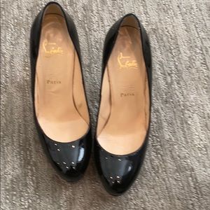 Christian Louboutin black patent pumps